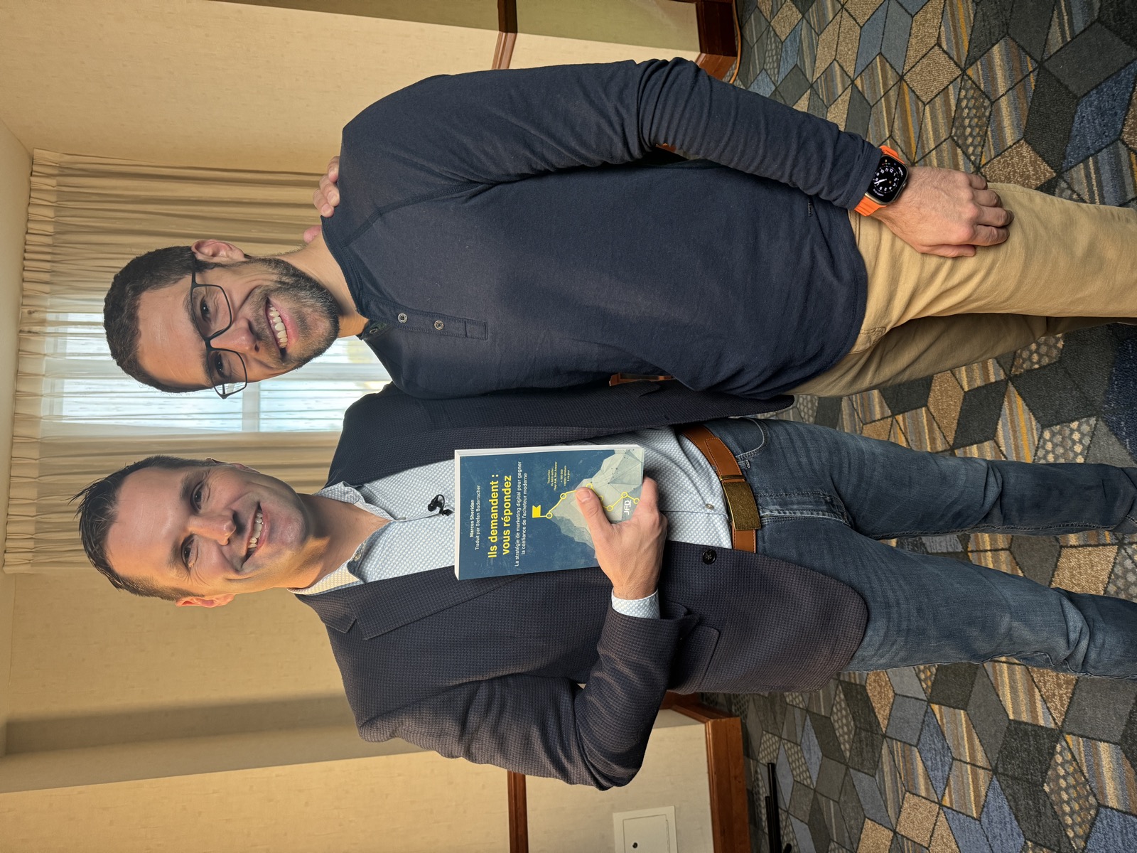 Stefan Badertscher with Marcus Sheridan holding the French edition of They Ask, You Answer